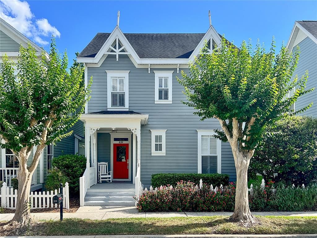 839 Lake Evalyn Drive storybook home in Celebration with front porch and mature trees