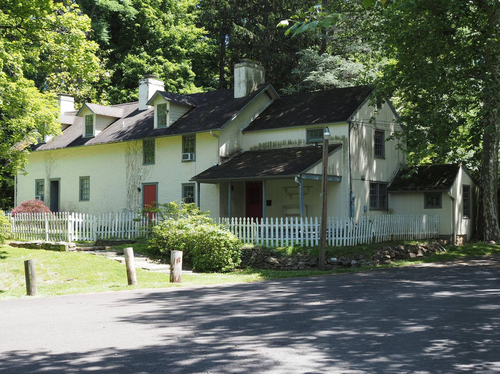 Traditional Pennsylvania home surrounded by greenery