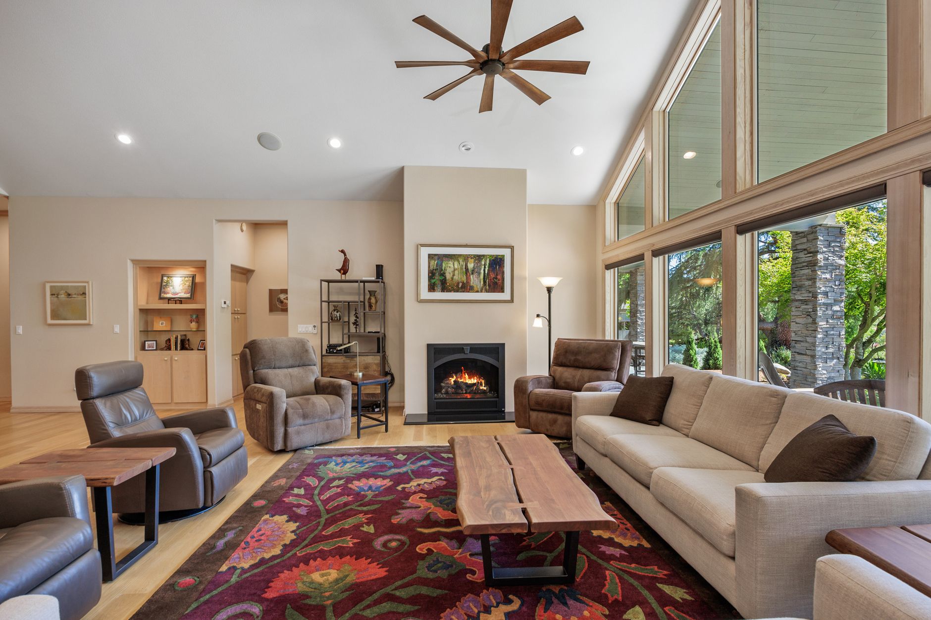 Refined living room with a fireplace and wide windows