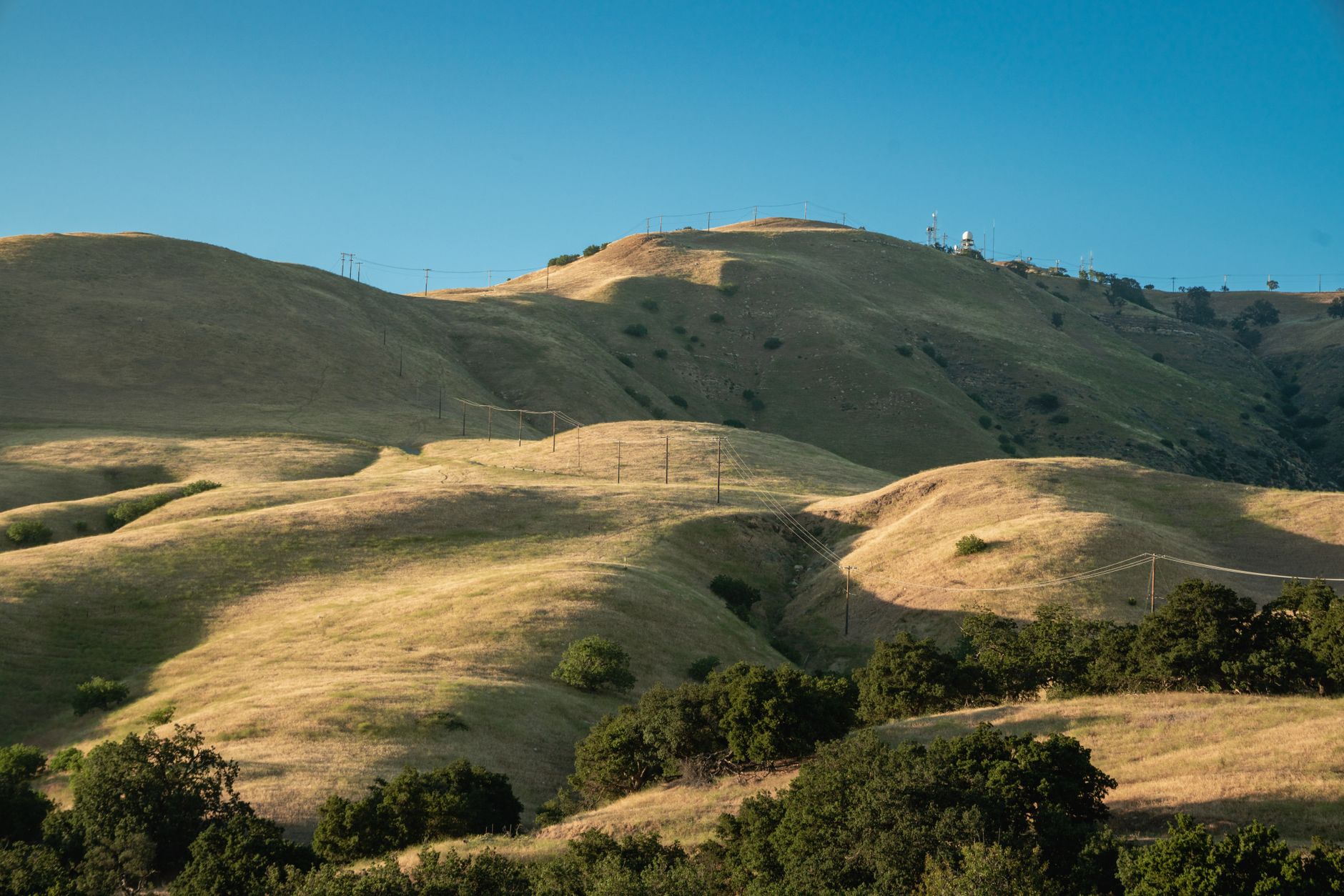 Rolling hills beneath a clear Northern California sky