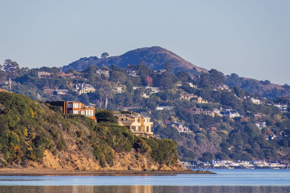 Hillside homes along a tranquil waterfront