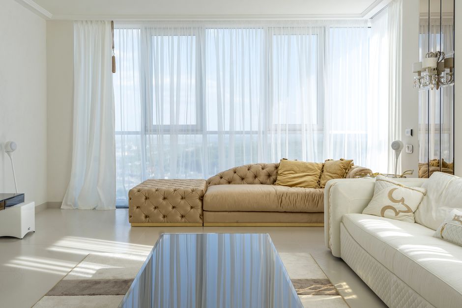 Warm refined living room with neutral seating