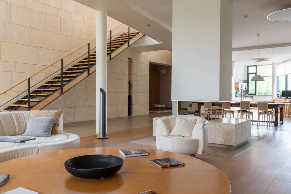 Contemporary living room with fireplace and high ceilings