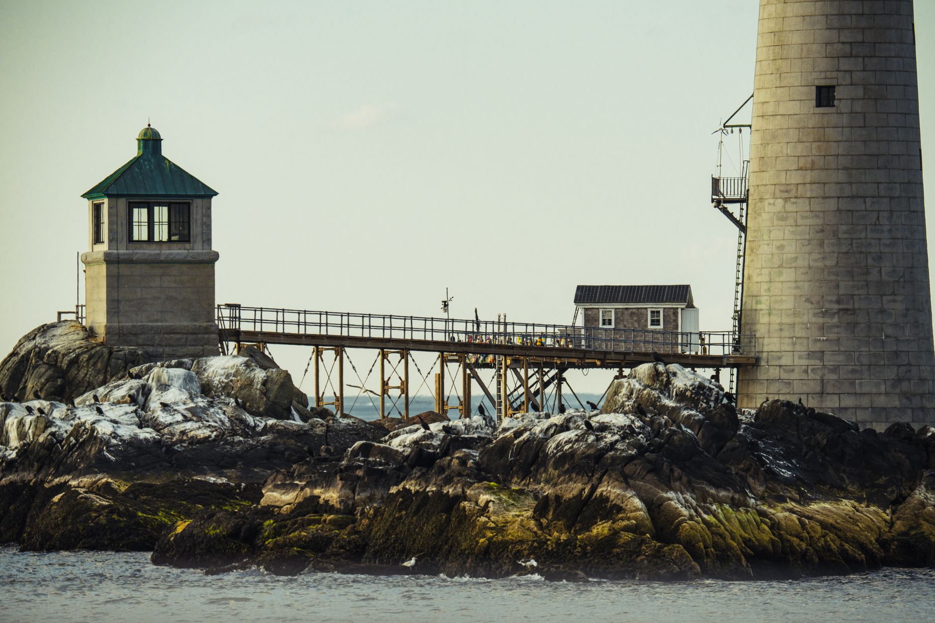 Rocky Massachusetts coastline with a lighthouse