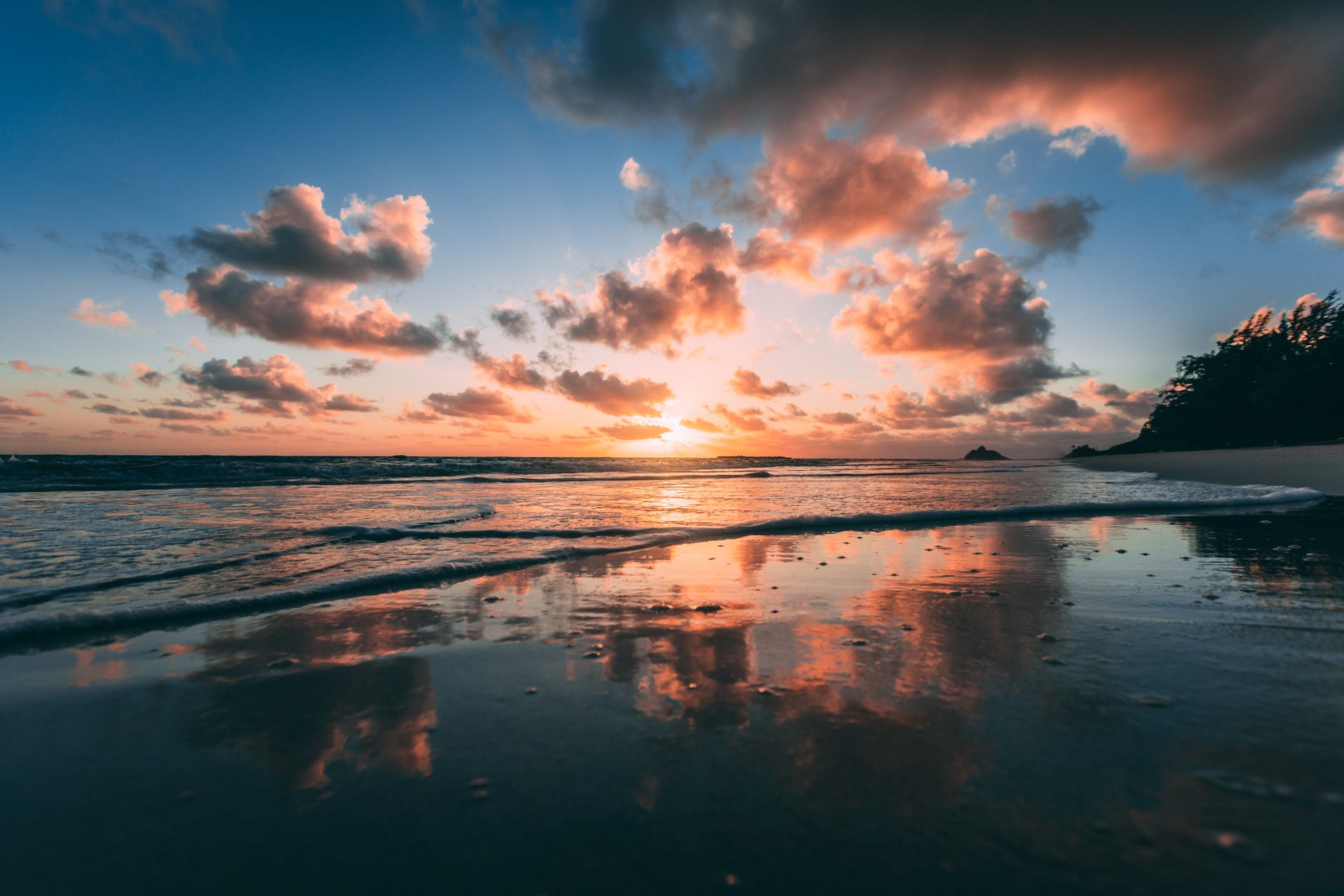 Sunrise over calm water at Kailua Beach