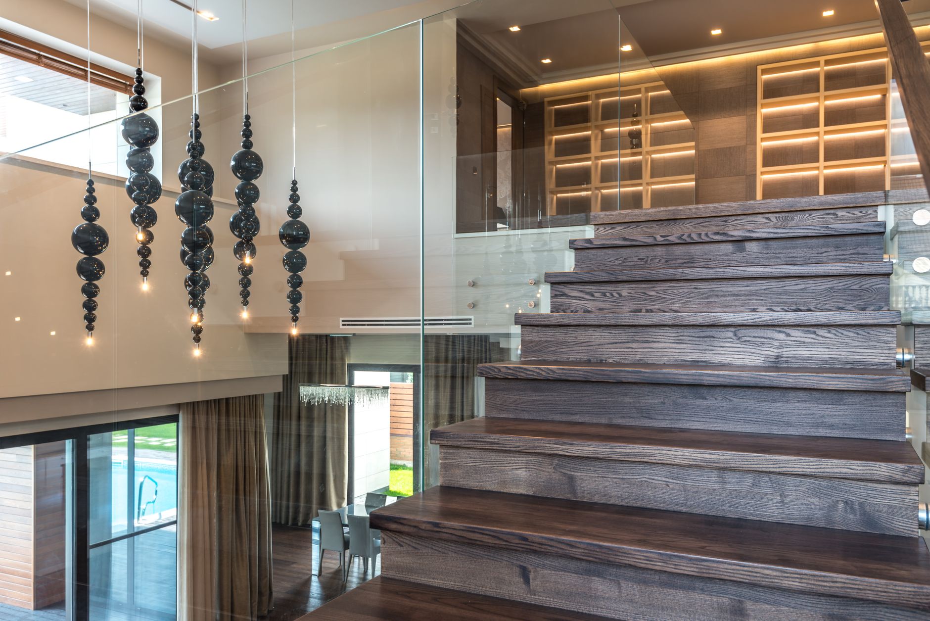 Architectural staircase with wood and glass details