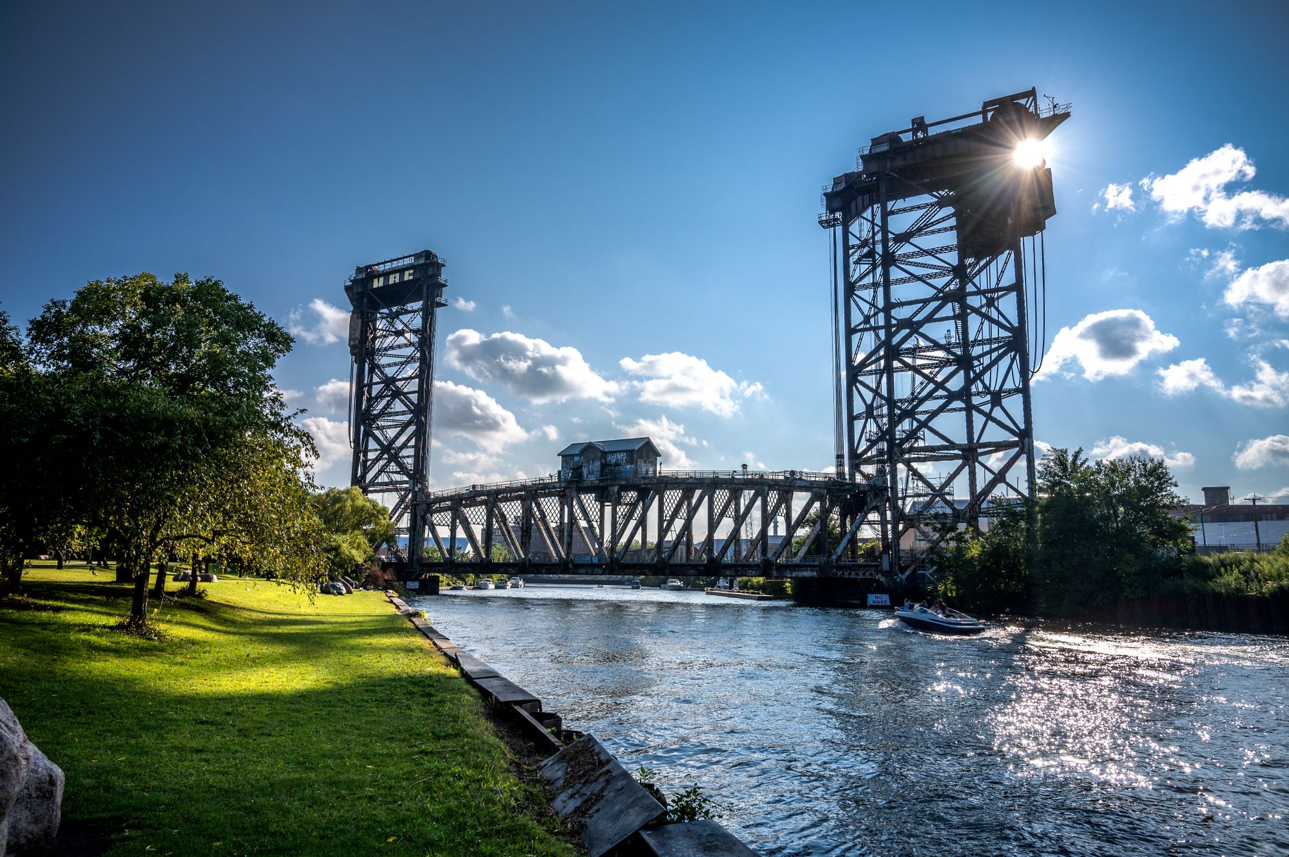 Steel bridge crossing the Chicago River with the city skyline beyond