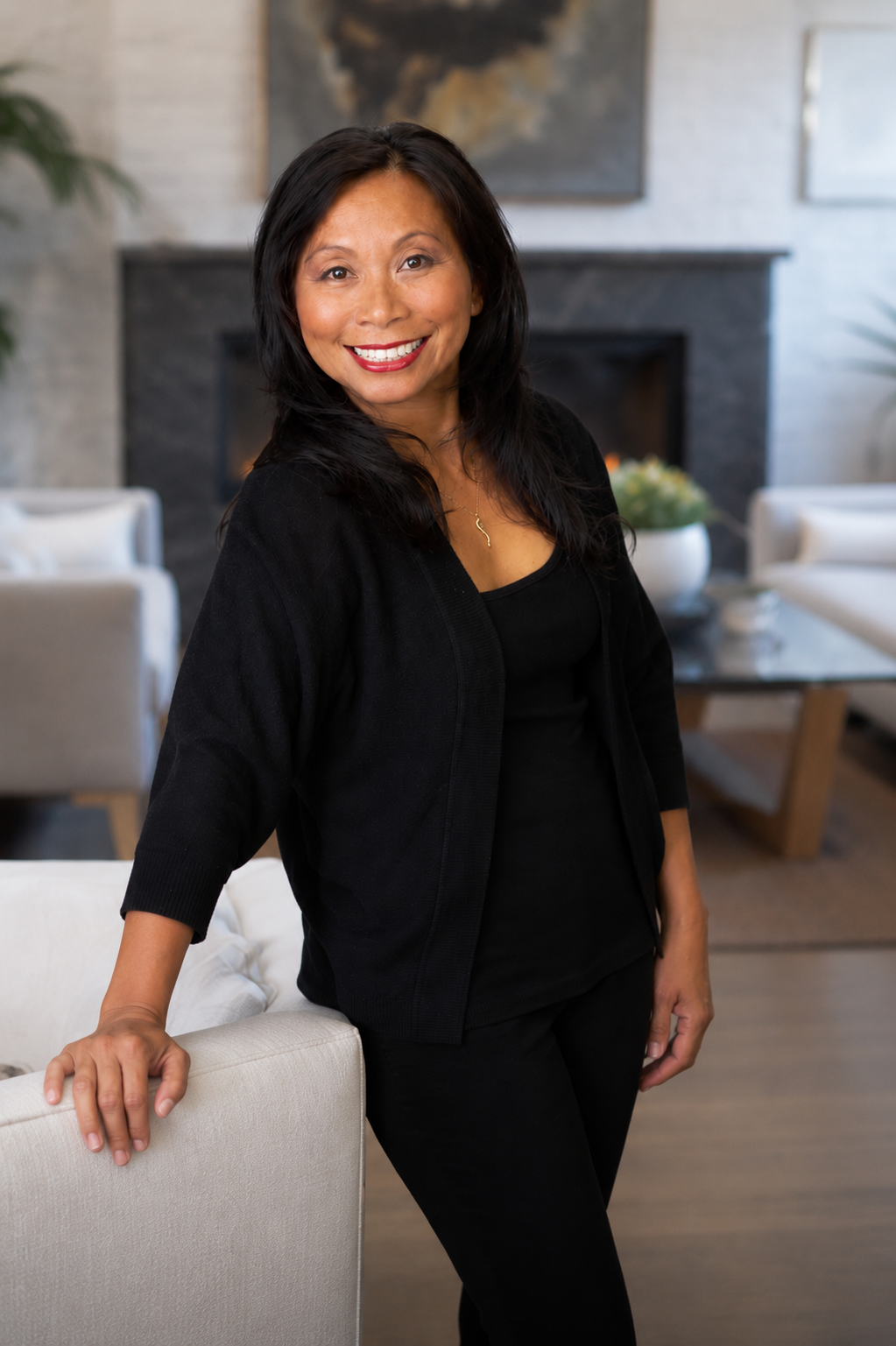 Kuo-Ying Frenzel standing in a modern living room