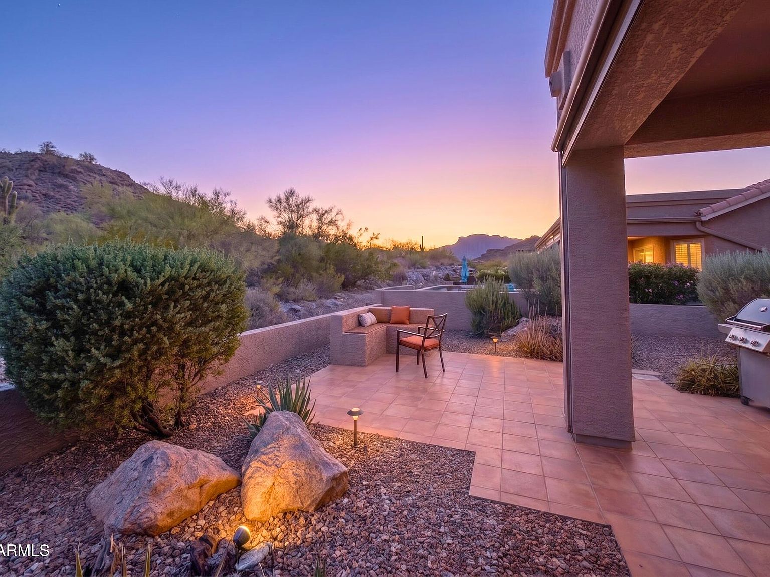 Desert home patio at sunset with mountain views