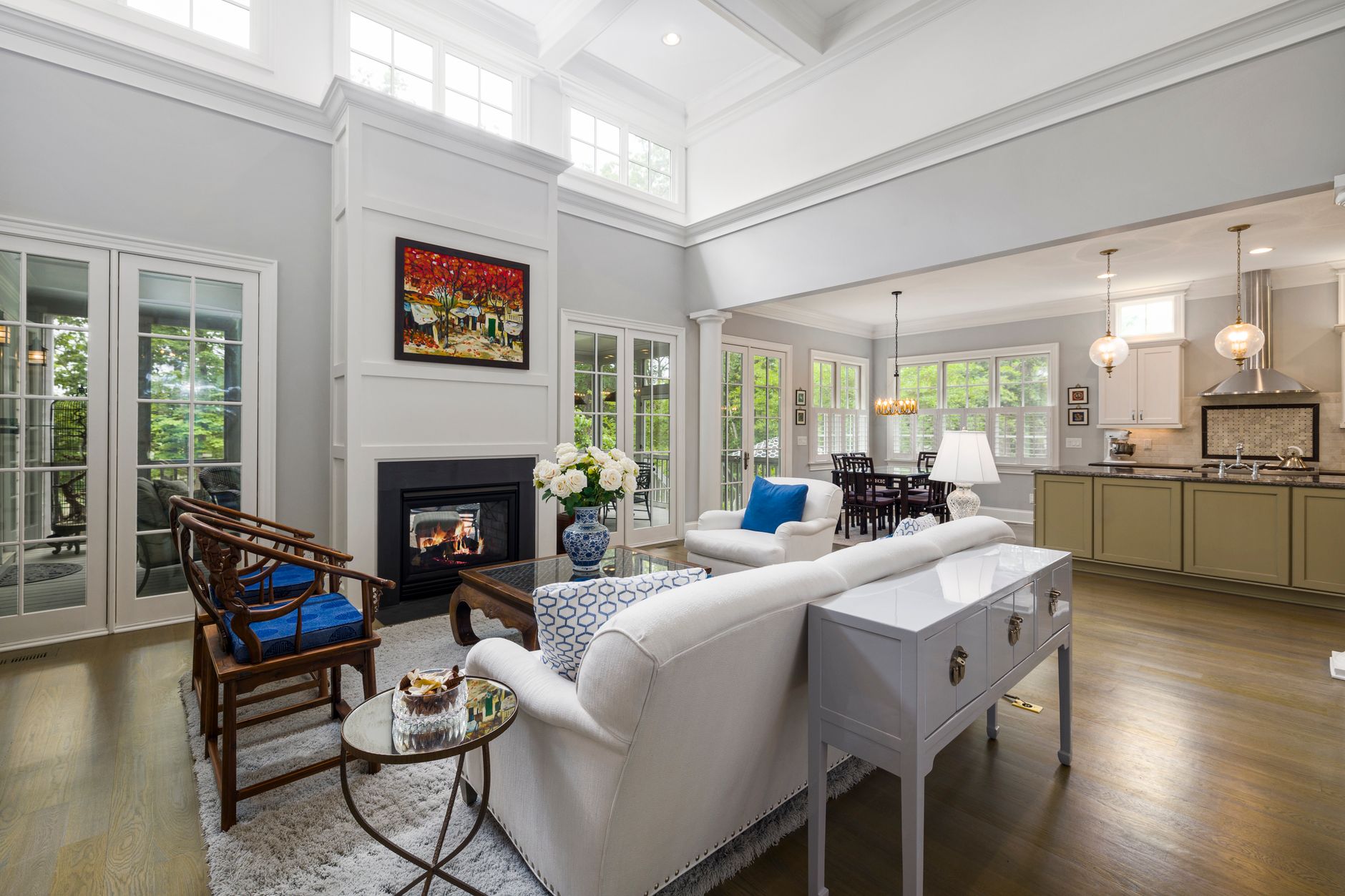 Contemporary living room and kitchen with high ceilings